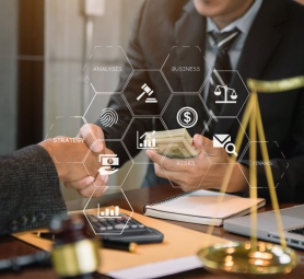 Businessman giving bribe money in the envelope to partner in a corruption scam in office.