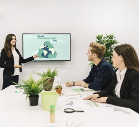 smiling-businesswoman-giving-presentation-world-environment-day-hr-colleagues
